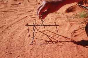 Making a stick house in central Australian red earth